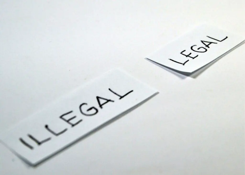 Small papers with illegal and legal written on them