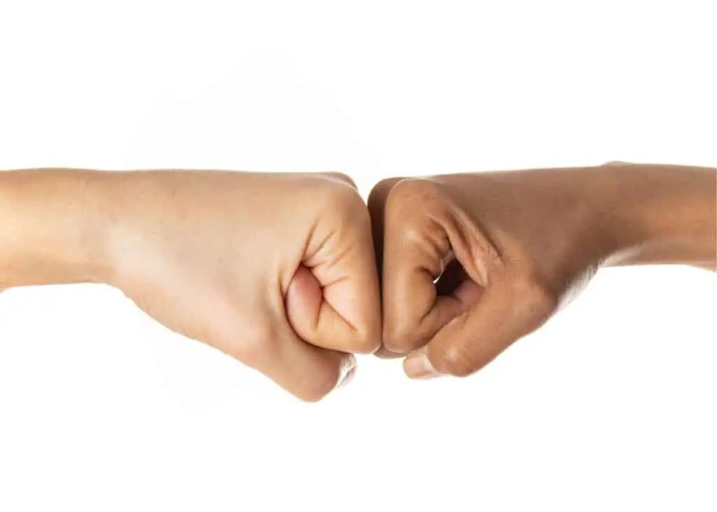 People fist bumping